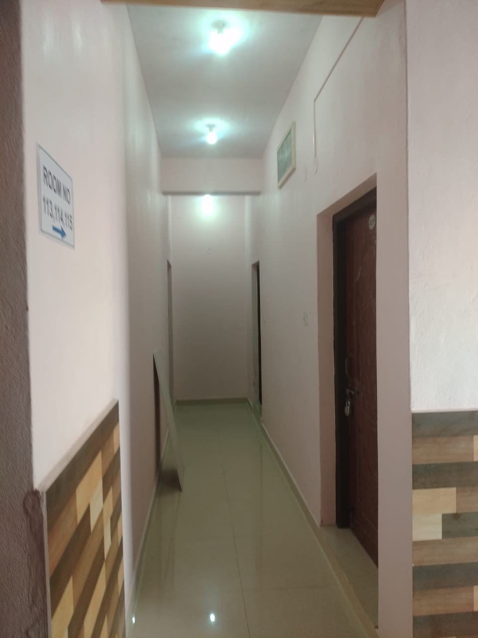 Bright, clean corridor with room numbers